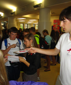 Brendan Vogel and Courtney Hahn are handing out ribbons and stickers, with a name of someone who passed away from this event, to commemorating the tragic day of September 11, 2001 on Friday Sept. 9 2011. 