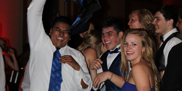 Shaan Muthukumaru, Cole Estrada and Kaily Gustafson (12) enjoy a dance and a laugh at Prom, April 6. 