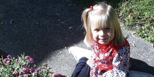 A five-year-old Casey Walker enjoys the sunshine outside with no thoughts of missiles.