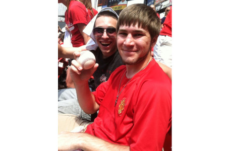 Drew Jackson and Kevin Rich celebrate after Rich caught Cardinal Carlos Beltrans homerun ball during the bottom of the fourth inning, May 1. Over 300 seniors enjoyed the 4-2 Cardinals victory over the Reds.
