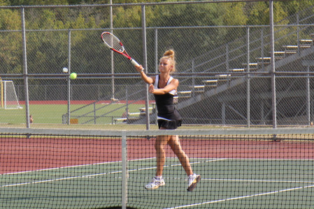 Ashlynn Gunhus, the Wildcats number two player, slams home a point against Oakville, Sept. 18.