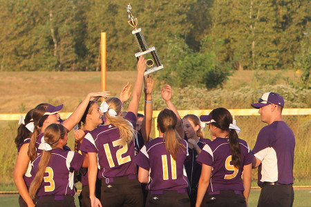 The Wildcats hoist the trophy after winning the Suburban Southwest Tournament, Sept. 12.