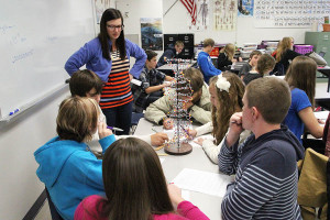 Samantha Buchanan, Lexie Beckermann, Bryce Bond, Abbie Lakey, Anthony Carrizales and Nathan Arata (9) work as a group to understand a detailed model of DNA in Mrs. Jeanette Bosomworth's 4th hour Biology class, Nov. 8.