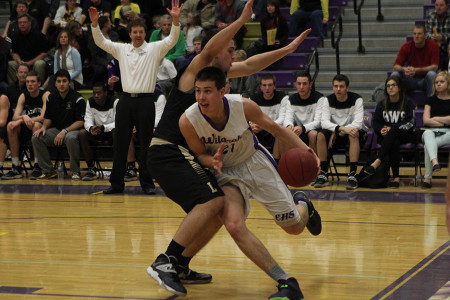 Forrest Nettles, forward, defending the ball, rushes past a Lancer putting a play into motion, Jan. 13.