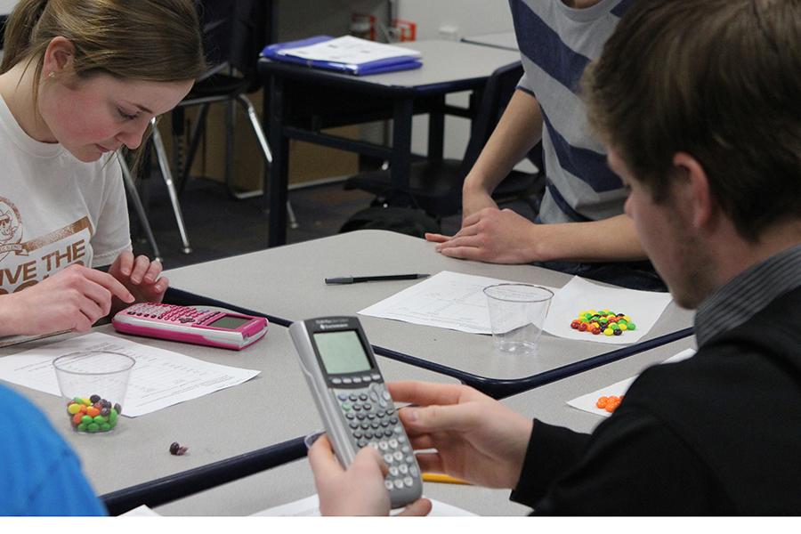Dilligently working with their caclulators and skittles, Shannon Goode works in Mrs. Widsoms 5th hour AP Statistics class. 