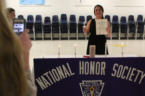 Celebrating her induction, Jennifer Marey gets her picture taken after the ceremony, April 23.
