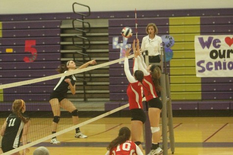Alexa McAndrew, outside hitter, leaps above the net for the spike against Ursuline, Oct. 9.