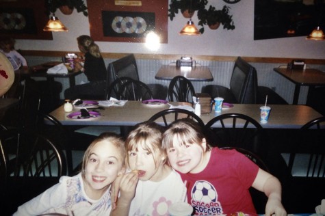 I love how I am shoving my face with food during a picture. To my left is my childhood best friend Carissa Bacandreas and to my right is my cousin Rachel Carlino. We were seven and celebrating something.
