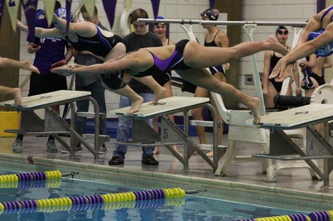 Leilani Mansy dives into the pool to start the first leg of the 200-yard freestyle relay during the home meet against Washington, Dec. 8. Her performance qualified her for state.