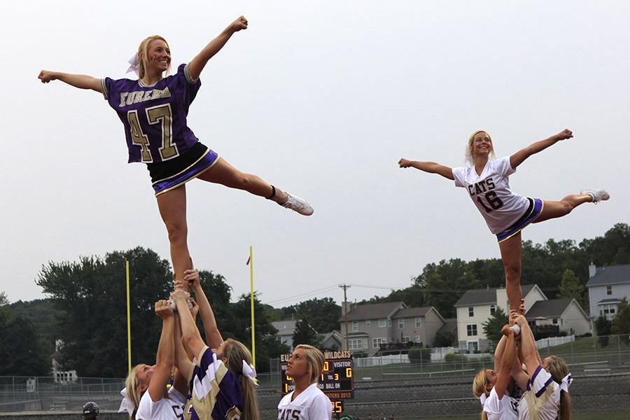 Cheerleaders do stunts during the Eureka VS Oakville game 