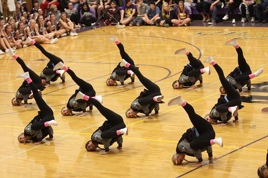 Golden Line preforms their hip-hop routine during the pep assembly on Oct. 2. 