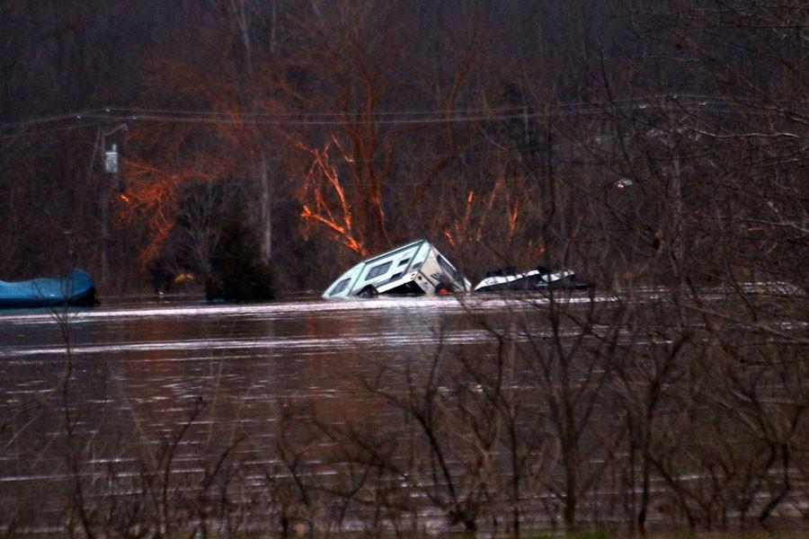 Flood water currents were strong enough to move this RV far from where it was left, Dec 30. 