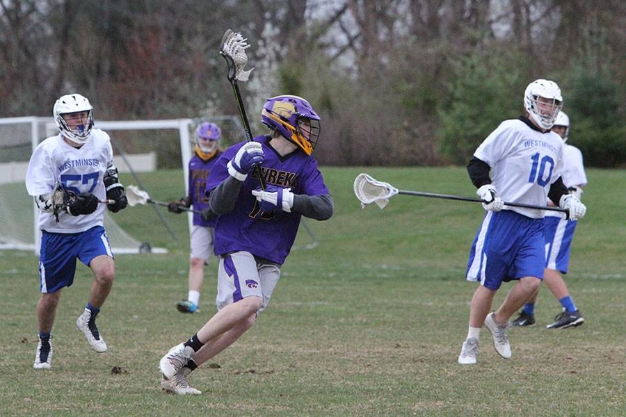 Boys JV lacrosse plays Westminster as Cole Crowder (9) catches the ball