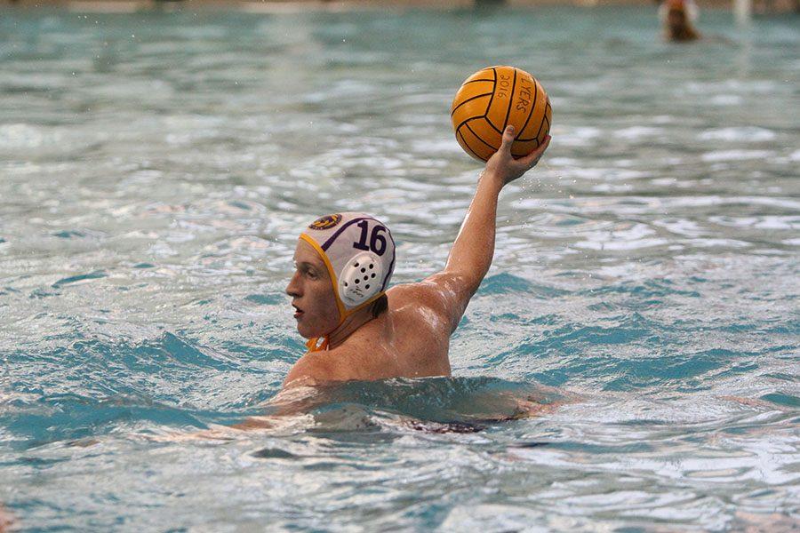 Ryan+Hastings%2C+Varsity+Water+Polo%2C+passes+the+ball+to+a+teammate%2C+April+11.