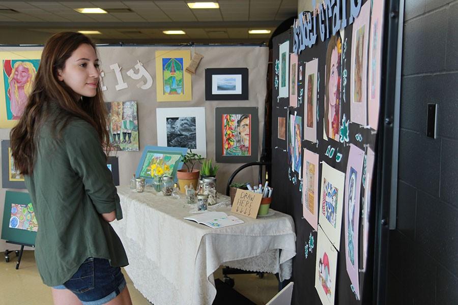 Sarah Corbett (10) admires Isabel Cranes art display, April 2, 2015.