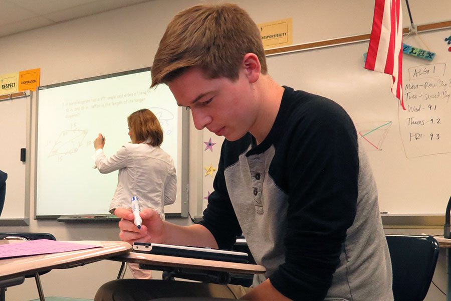 Zachary Wren (12) practices calculations in Trigonometry class, May 3.