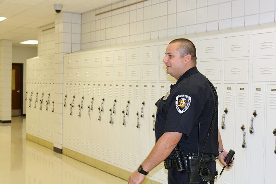 Officer Brett Grittini, SRO, walks through the hallways of EHS, Aug. 16. Having worked for EPD, he enjoys furthering his connection to the community. Ive coached some of the kids that just graduated here so Ive gotten to watch them grow up, Officer Grittini said. Now Im looking forward to getting to know a lot more kids.