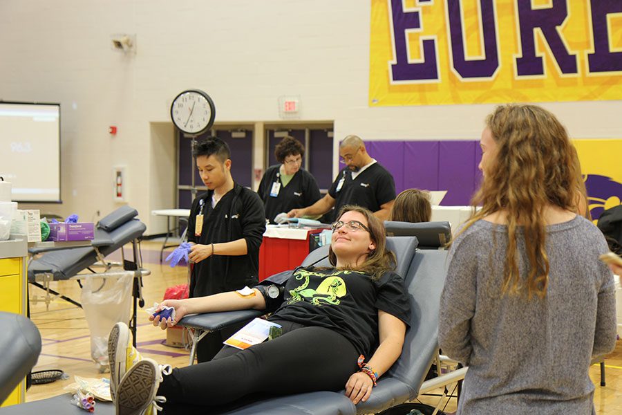 Olivia Schinsky (12), sits while donating blood at the blood drive, Sept. 12. “I got kind of loopy, but it was worth it because I knew I was helping others,” Schinsky said. “It didn’t really hurt, but I felt super strange especially when I stood up. I saw people that weren’t feeling well, and it was really weird because I was in the same position, and I was worried that might happen to me.”