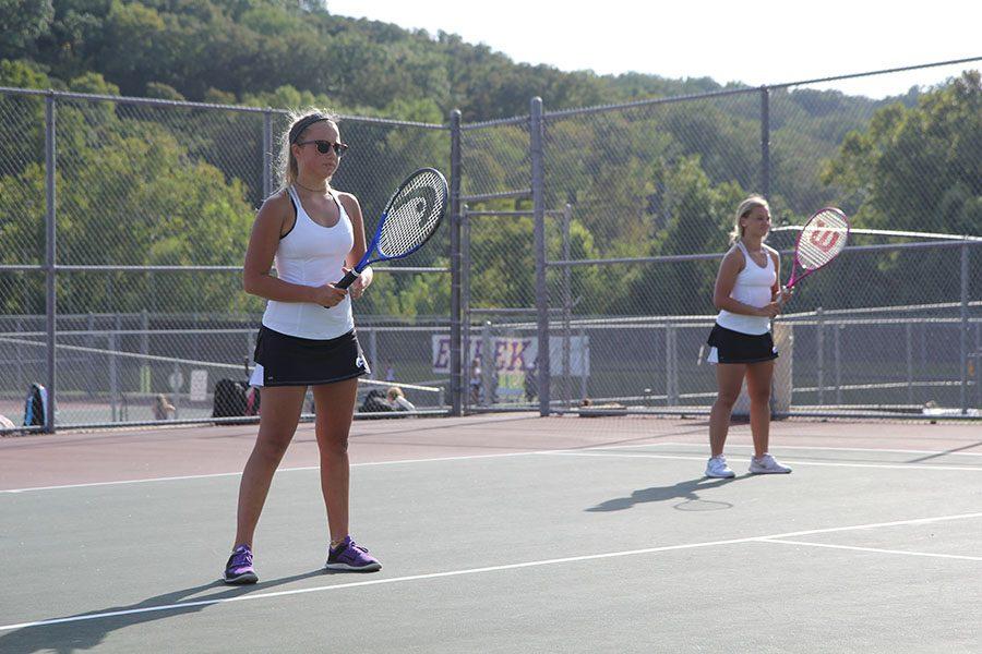 Ready for the next set, Laney Fonke and Eva McNamee, JV tennis, prepare to play their Parkway West opponents, Sept. 7. “I love tennis. This is my first year playing,” Fonke said. “During our match we won 7-5. It was close; we had to do a tie breaker.” The Wildcats. won the meet 9-5.