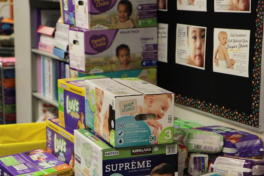 Cardboard boxes packed with hundreds of diapers sit in room 108, Oct. 18. “Clean diapers are important to growing infants and toddlers,” Jordan Thompson, student organizer, said. “We need to do what we can to help.”
