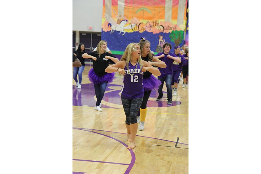 One last practice, Hannah Daffron (10) and Leah Schumacher (11) performance with the rest of Onstage! In Gym A before the Homecoming Pep Assembly starts, Sept. 30. “We were all nervous,” Daffron said. “We have a lot of new members, and it was an upbeat song so we had a lot of moves.”