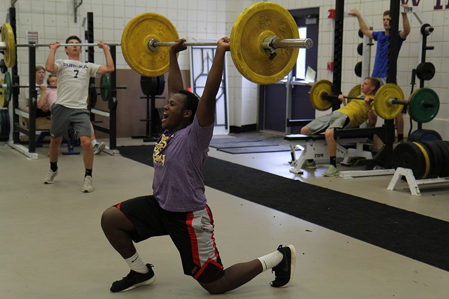 Pushing himself, D’Antoine McMillon (11), lifts 50 pounds in Advanced Strength Training, Oct. 6. McMillon is both a football and rugby player. “I just want to become a better athlete,” McMillon said.
