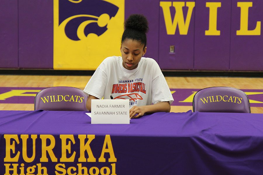 Looking to the future, Nadia Farmer (12) signs with Savannah State University, Nov. 7. “I really like the academic support they have down there. I feel like I could be really successful when I go there,” Farmer said. “It was a great experience because not every girl can say they had the opportunity to sign with a college for basketball. I am really thankful and grateful.”