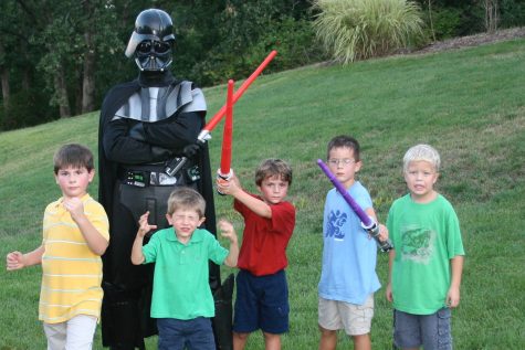 The dark lord of the Sith, Darth Vader (Mike Weaver, my father) poses with me, Jack Weaver, my brother; Dale Manzo, my cousin and my friends Nathan Bauman (12) and Griffin Anderson  at my eighth birthday party, Aug. 26, 2006. Before taking this picture, my mother, Angela Weaver, handed out a variety of light sabers for all of our guests to fight with. 