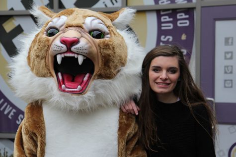 Posing with Wilson the Wildcat, Emily spends one last time as a Eureka Wildcat, Dec. 16.