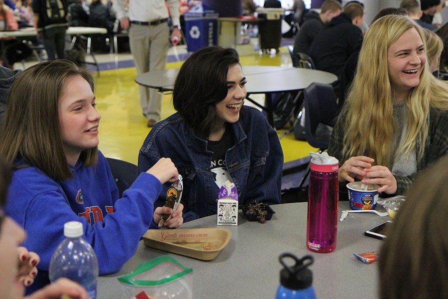 Enjoying their freetime, Kaitlyn Schormann (10) and her friends laugh at each other during lunch, Feb. 8. “Dennis [Brock] (11) was pretending he was choking,” Schormann said. “It was funny because of what was going on around us.”