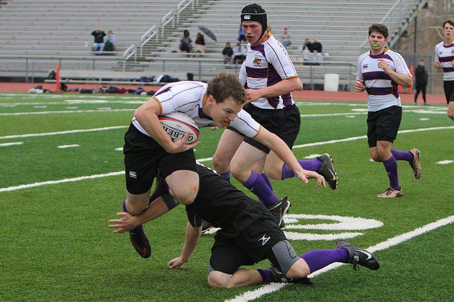 Adding to the potential comeback, Jack Borror (11) rushes down the field to help his team score during the rugby game against CBC, March 5. “It was a rough loss, but we had a lot of new people, so we were just getting used to the game. It was just a learning experience for everyone,” Borror said. “The first game of the season we weren’t really in the mindset of tackling. You get your first hit and you realize how intense the game is really going.” Eureka Rugby Club lost, 14-15.