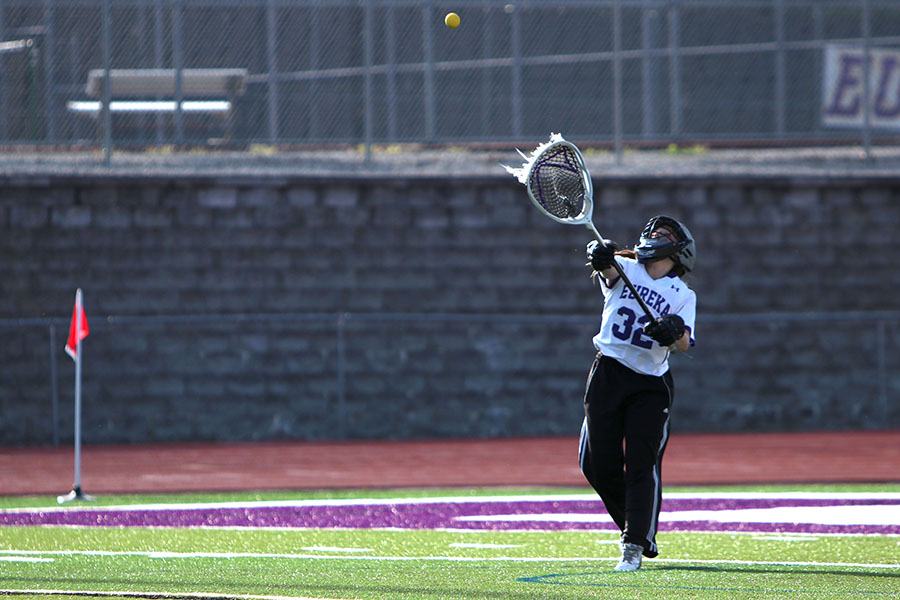 Intensity at its highest, Molly Kerr, goalie, throws the ball down field to her teammates during the Varsity Lacrosse game against Lafayette, May 15. “It was a difficult game. Lafayette definitely came out prepared and we were definitely more flat on our feet than we should have been. It was a rougher loss than usual, but our team is a family,” Kerr said. “Personally I felt like I was doing a good job. I let in eight but I stopped more than half of the shots so it was a good game for me.” The Wildcats lost, 7-8.