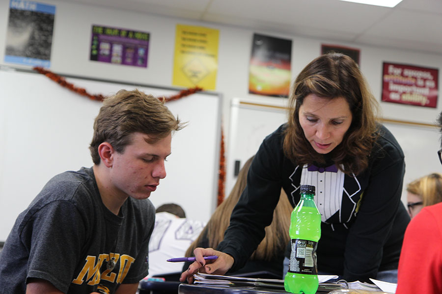 Robbie Dutton receives clarification from Sieloff in her 6th hour Geometry class, Oct. 4.