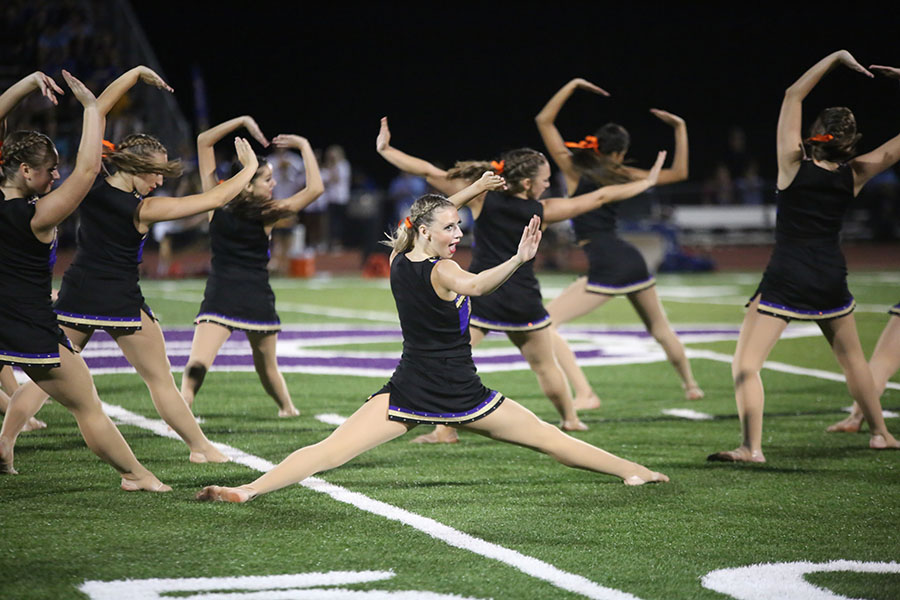 Stephanie Lubinski executes the splits during Golden Lines halftime performance during the varsity football game against Francis Howell, Aug. 25.