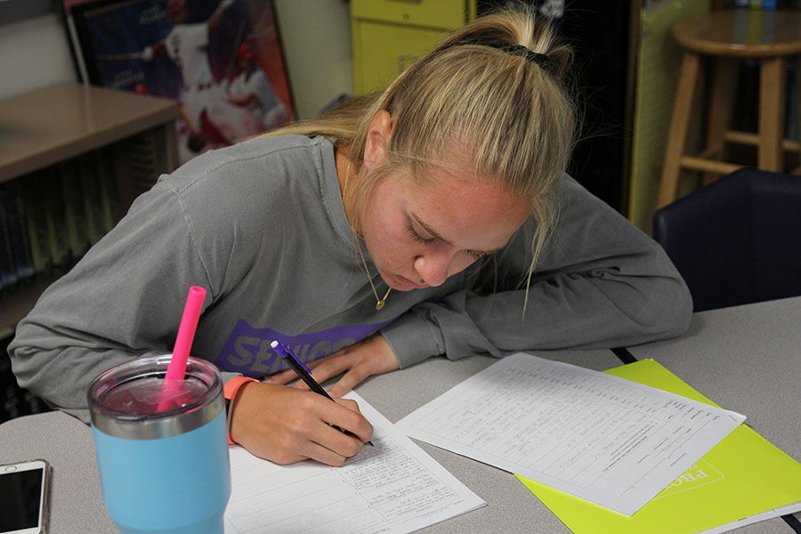 Game story in progress, Claire Marin (12) writes down questions she prepares to ask the field hockey coaches in Mark Mosley’s Sports Literature class, Aug. 30. “I have been around sports my whole life from watching them on TV with my family to starting soccer when I was in preschool,” Martin said. “I thought this class would be a fun way to see the other side of the field and help me understand a different perspective than just a viewer or a player.”