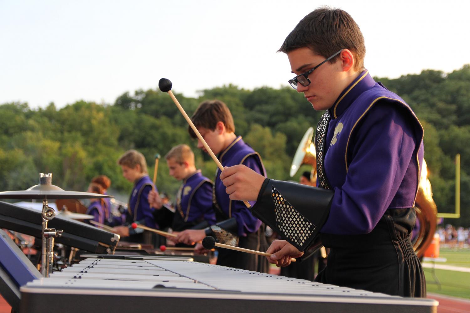 Cole Huntley plays the vibraphone during On Eureka, at the beginning of the varsity football game against Pattonville, Sept. 1. My favorite part of preforming at the games is showing everyone what weve been learning by playing the show music, Huntley said. After practicing for hours on marching and music, the shows give us time to piece it all together and show people how hard we work. 