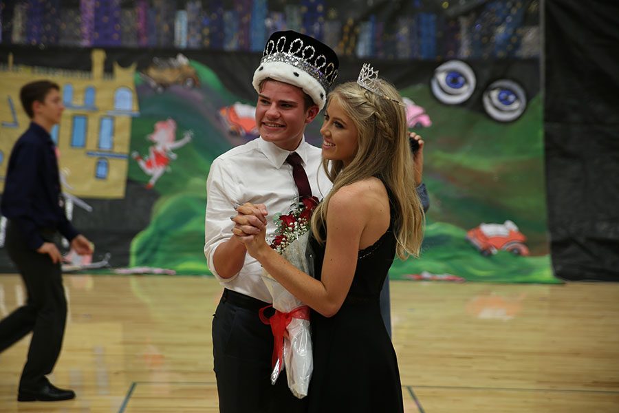 King and Queen crowned, Jerod Turner and Elle Baker (12) pose for a picture at the Party with Gatsby themed Homecoming Dance, Oct. 7. “It was kind of overwhelming,” Turner said. “The whole school was looking at me, looking how I was going to react. Then everyone knew who I was. Everything about me was out there. It was crazy. I realized how many people were actually with me. I had so many friends surrounding me. It was all so surreal. I thought I only had the people in my ‘group,’ but--in reality--I had support from so much more. Before this, Elle and I weren’t super close, but after winning together she is like my sister and someone I will never forget. She is my queen.”