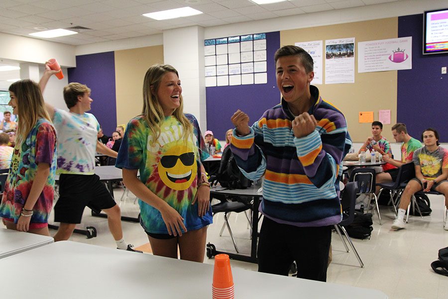 Triumphant, Zoe Gustafson and Nate Koenig (11) win the cup stacking challenge for Spirit Week points during second lunch, Oct. 3. “My competitive spirit as well as desire to win took over, and I really wanted to win the Spirit Points for my grade,” Koenig said. “I like to think of myself as a thoroughbred race horse that simply cannot lose. With my years of experience as a cup stacker, once the hands get moving it was all over for the other teams. There is no better feeling than that of victory.” 
