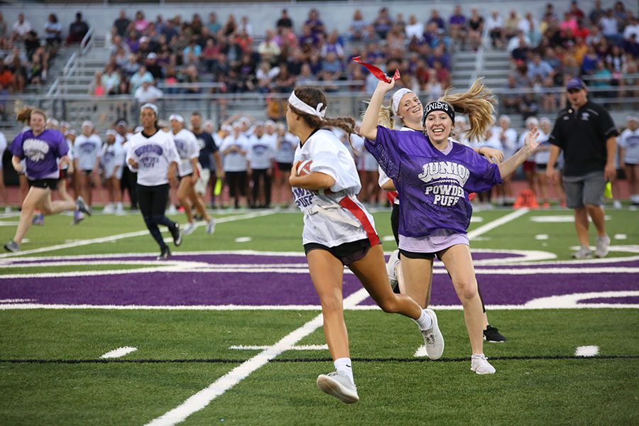 Play+coming+to+a+halt%2C+Isabel+Cooper+%2811%29+snatches+senior+Jessica+Brushaber%E2%80%99s+regaining+junior+possession+during+the+Powderpuff+Football+game%2C+Oct.+5.+%E2%80%9CIt+was+really+intense%2C+and+everyone+was+super+hyped+up%2C%E2%80%9D+Cooper+said.+%E2%80%9CIt+was+really+fun+to+be+with+everyone.+I+didn%E2%80%99t+think+I+was+going+to+be+able+to+play%2C+and+whenever+I+got+in+there+I+was+so+excited.+When+I+actually+made+a+play+and+got+someones+flag+it+was+awesome.+I+wasn%E2%80%99t+mad+when+we+lost+because+it+was+one+of+the+closest+games+Eureka+has+seen+in+awhile+and+it+was+super+fun.%E2%80%9D+The+seniors+won%2C+14-12.+