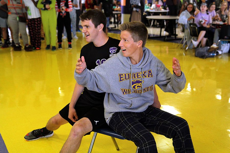Checking for conformation of his win at musical chairs, Josh Jackson (12) makes sure the judges confirm his win after being hip checked by Ryan Schwentker (9) in order to win class points for lunchtime activities, Oct. 5