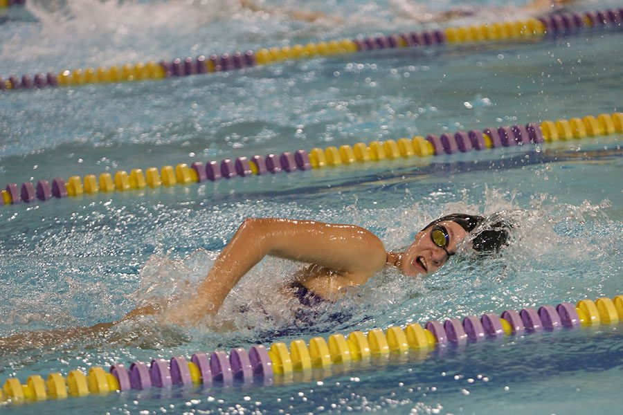 Senior+night+in+progress%2C+Julia+Wizeman+swims+her+last+100m+breaststroke+of+the+night%2C+Jan.2.+%E2%80%9CI+like+the+people+on+the+team+more+than+the+sport%2C%E2%80%9D+Wizeman+says.+%E2%80%9CThe+sport+isn%E2%80%99t+always+the+best+because+it+is+winter+and+the+water+is+always+cold.+We+get+out+of+practice+and+we%E2%80%99re+cold%2C+and+we+go+outside+and+our+hair+freezes%2C+which+isn%E2%80%99t+always+fun.+Celebrating+senior+night+is+my+favorite+night+out+of+all+of+the+swim+meets.+We+had+a+great+group+of+seniors+and+being+able+to+thank+them+for+their+dedication+to+the+team+is+so+much+fun.+They+deserve+to+know+how+awesome+they+are.%E2%80%9D