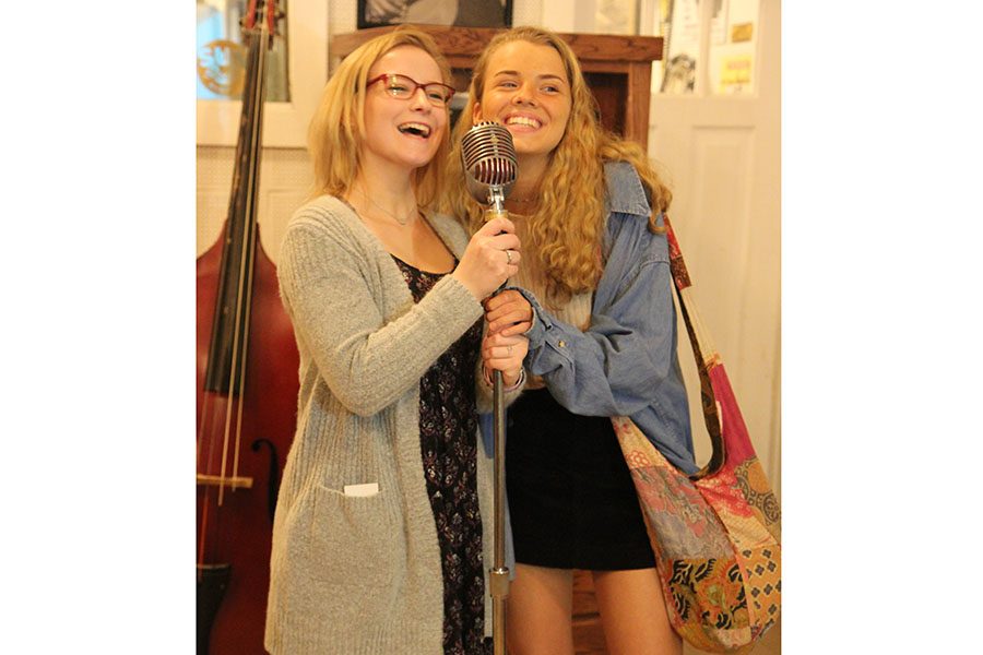 Sightseeing, Victoria Koenig and Ariana Mullins (11) pretend to sing at Sun Studios in Memphis with Orchestra, March 23. “I had a lot of fun,” Mullins said. “We played at Graceland at Elvis’ house. We played ‘Can’t Help Falling in Love’ by Elvis. It was  [Mary White] our teacher’s mom’s favorite song. She started getting emotional while we were playing because it brought her good memories. It was a sweet moment.”