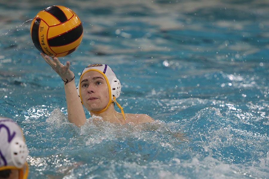 Ready to throw, Ethan Larson looks for a teammate to pass to during the water polo game at Lafayette, March 26. I like just being able to do an after-school competitive sport with my friends, Larson said. I also enjoy the work that comes with trying to become a better player. I didnt mean to join the water polo team. I just came to the tryouts as a joke and ended up liking the sport. The Wildcats lost, 4-15.
