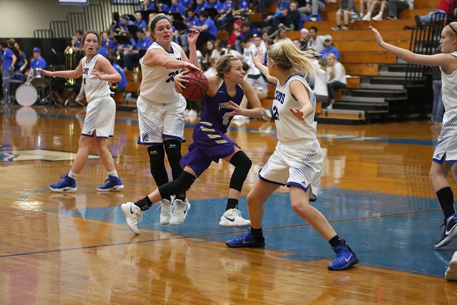 Katelyn Hillyer, shooting guard, dribbles past her Northwest opponent at the girls varsity basketball game, Feb. 2. “We are all super close,” Hillyer said. “The seniors are so good about keeping everyone included. Everyone loves everyone, which makes for a lot of fun at games and practice. The closeness helps in games because we are able to communicate better. The game went well. We played as a team and were able to finish with a win. We definitely made some mistakes, but we pulled it out as a team. I have some of the most amazing teammates, and I think thats how we have been having such great success.” The Wildcats won, 61 to 41.  Hillyer made the Missouri Basketball Coaches Association Class five District four All-District team.