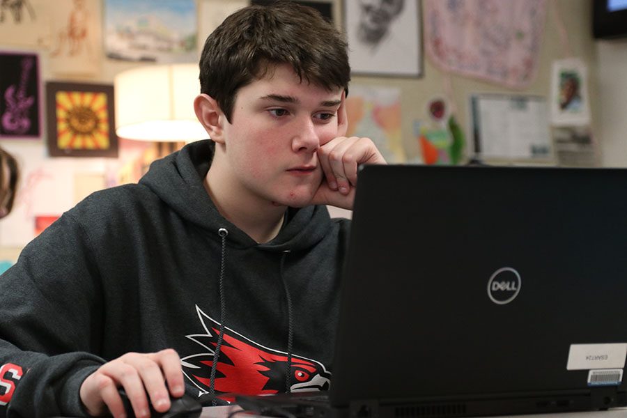 Surreal scene being worked on, Ryan Cundy (9) works on his project during Diane Bashirian’s sixth hour Graphic Design 1 class, Feb. 15. “I like drawing and computers, so I combined them and joined Graphic Design,” Cundy said. “In the surreal scene, I took the Rocky Mountains and combined extraterrestrial life to it. Graphic Design allows me to express myself. Photoshop allows you to have so much freedom.” 