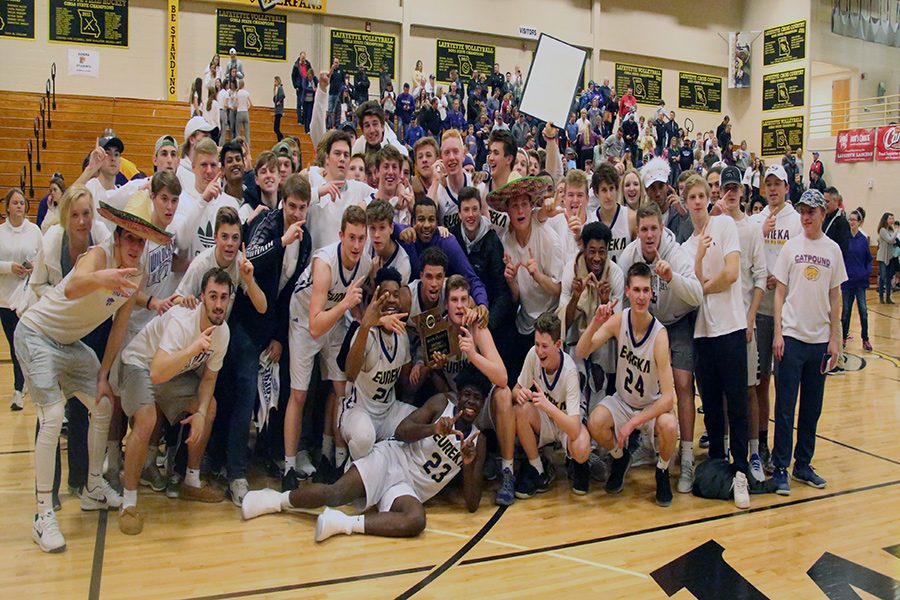 The EHS boys varsity basketball team poses with the Catpound after winning the district championship game against Parkway South, 63-46, March 1. 