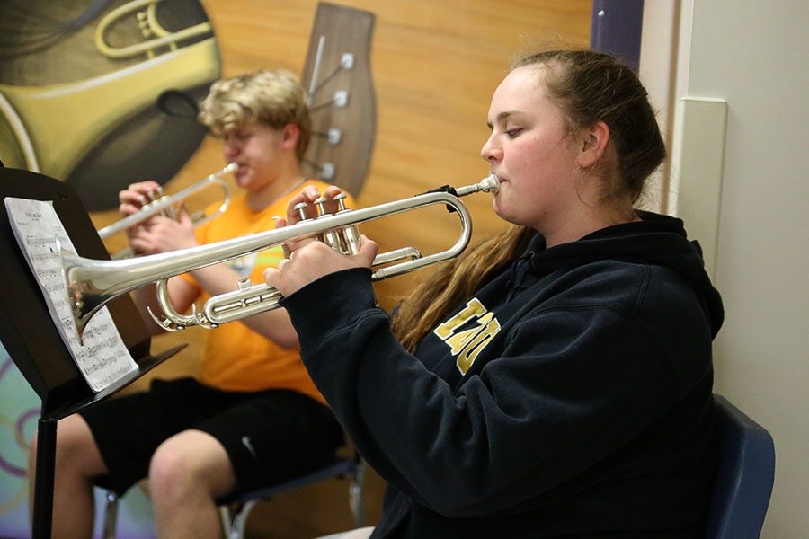 After school tutoring, Noelle Derennaux (11) practices with band for solo and ensemble after school, Feb. 27. “I am nervous for solo and ensemble,” Derennaux said. “We have to practice really hard so we can make it to state. In state, you are up against so many people. It is challenging. I play the trumpet. I like the sound and how close the trumpet players are.”