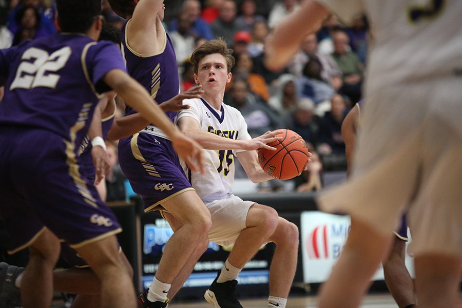 Cade+Bigham%2C+guard%2C+looks+to+shoot+the+ball+during+the+Eureka-CBC+basketball+game%2C+March+6.+The+Wildcats+lost%2C+62-30.+