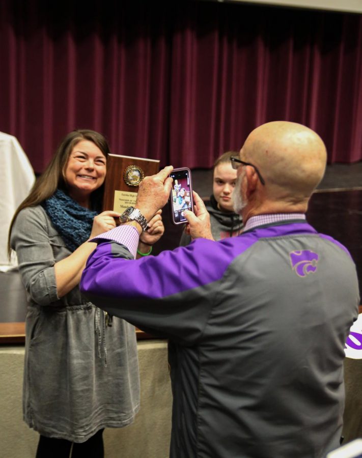 Charlie Crouther, principal, takes a photo of Mandy Kotraba, Science, after Kotraba was announced as the 2020 Teacher of the Year at EHS, Feb. 18. 