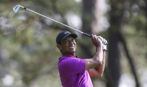 Tiger Woods hits from the 4th tee during the third round of the Masters at Augusta National Golf Club on Saturday, Nov. 14, 2020, in Augusta, Georgia. (Curtis Compton/Atlanta Journal-Constitution/TNS)